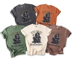 T-shirts in gray, orange, green, cream, and brown featuring a wizard graphic and "Bachelor Party" text.