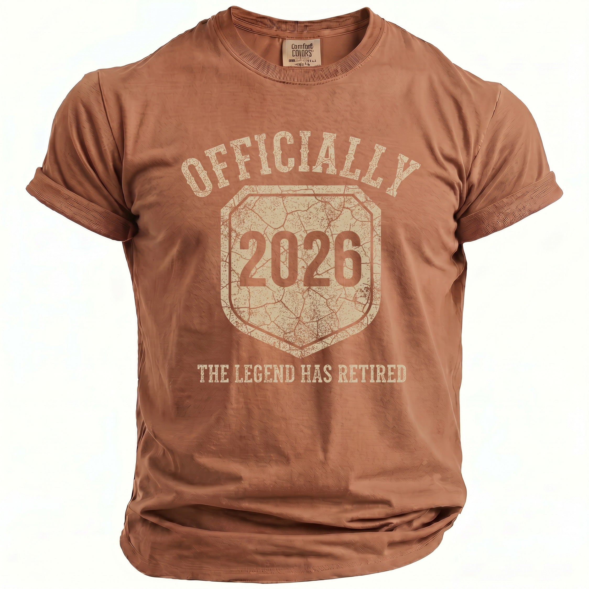Brown t-shirt with "OFFICIALLY 2026 THE LEGEND HAS RETIRED" graphic.