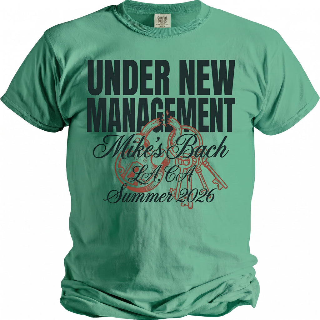 Green t-shirt with "Under New Management Mike's Bach LA, CA Summer 2026" text and graphics.