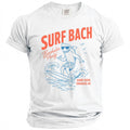 White t-shirt with a shark surfing graphic and text "SURF BACH Bachelor Party GAME OVER. ENGAGED AF."