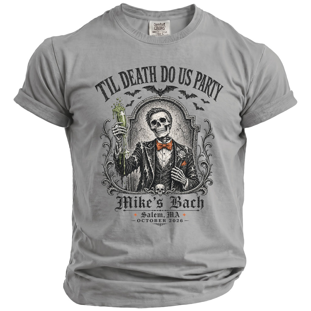 Grey t-shirt with skeleton in suit holding drink; "Til Death Do Us Party Mike's Bach October 2026".