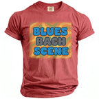 Red t-shirt with "BLUES BACH SCENE" text in blue and gray bubble letters.