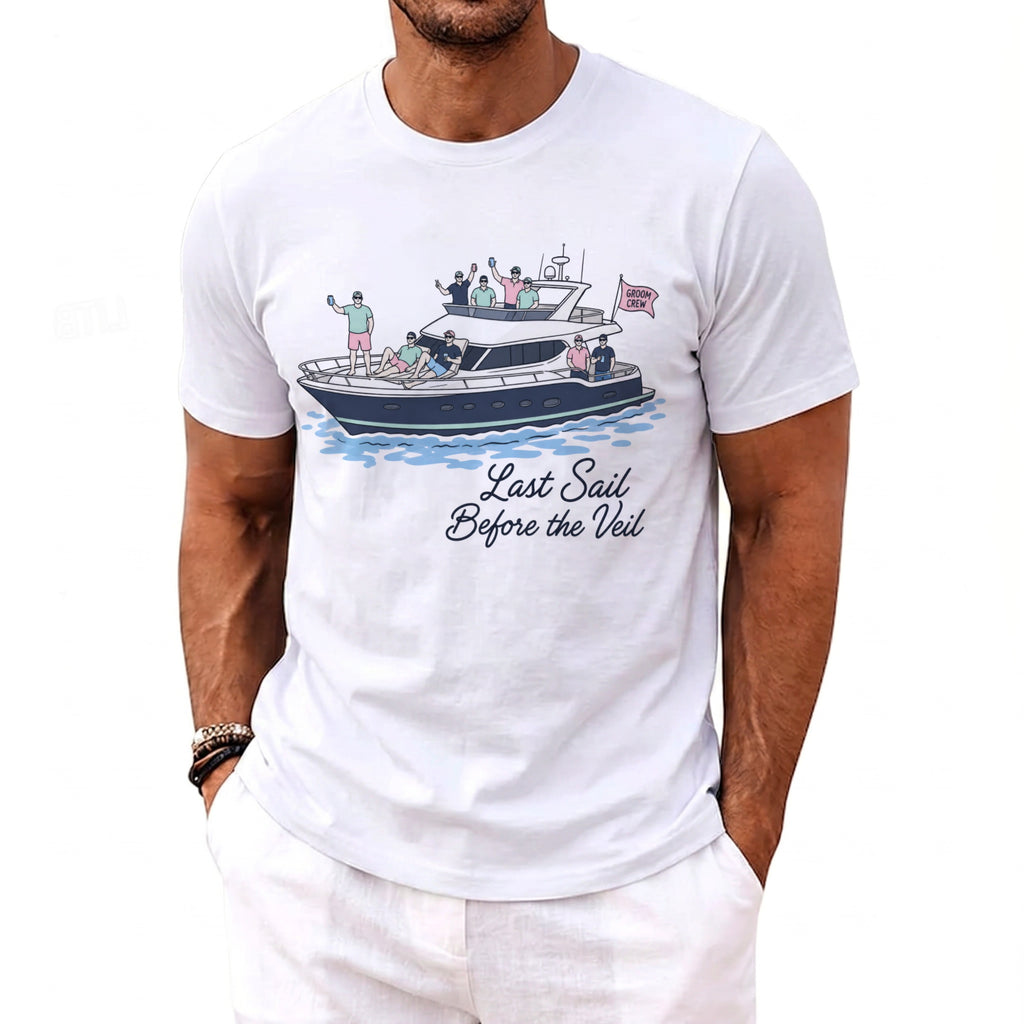 White t-shirt with a graphic of a yacht and men, reading "Last Sail Before the Veil."