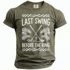Olive green t-shirt with "Last Swing Before The Ring" text and golf graphics.