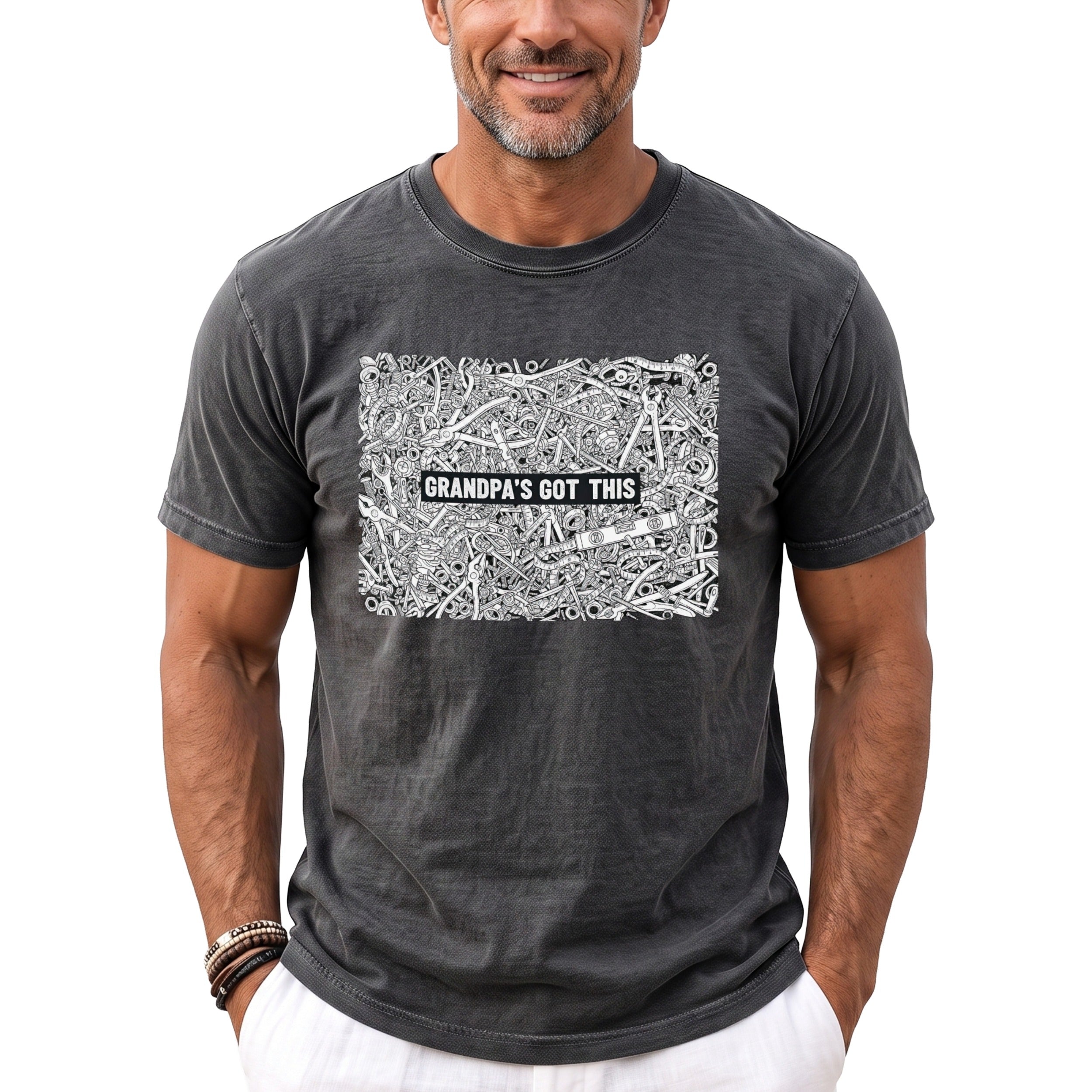 Gray t-shirt with a detailed illustration of tools and the text "GRANDPA'S GOT THIS".