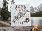 Banner with "Bach Rodeo Party Kenneth Est. 2026" and bull rider graphic.