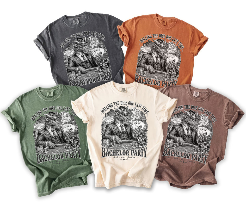 Five t-shirts in different colors featuring a dragon playing poker with text about Las Vegas.