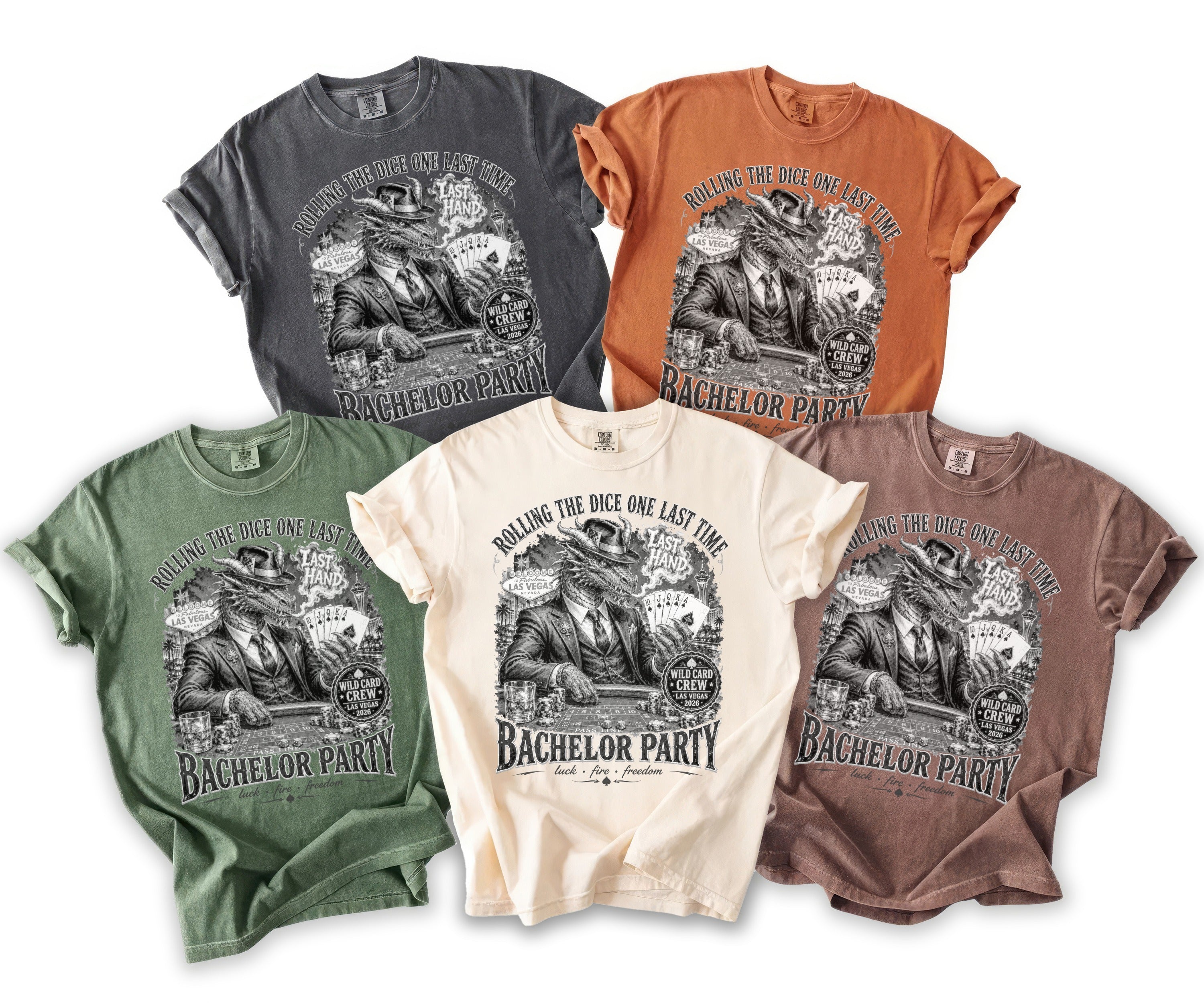 Five t-shirts in different colors featuring a dragon playing poker with text about Las Vegas.