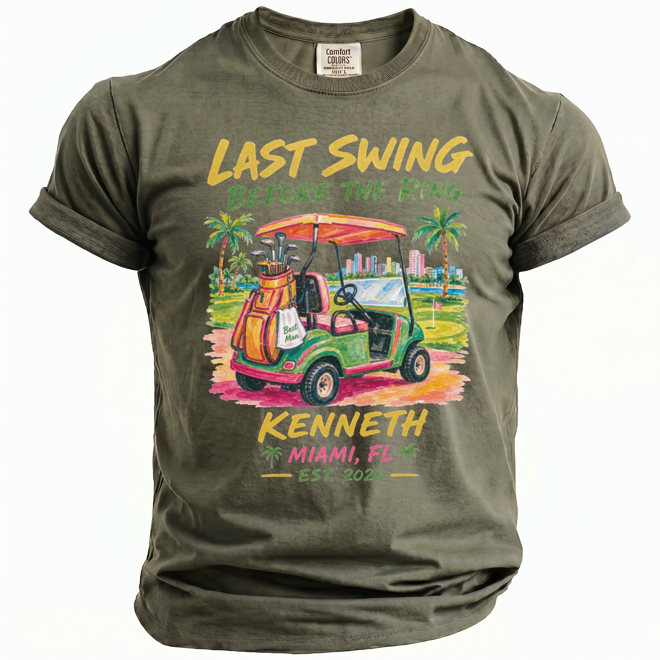 Olive green t-shirt with "Last Swing Before the Ring" graphic of a golf cart.
