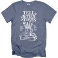 T-shirt with "Tell Better Stories" and art supplies over books.