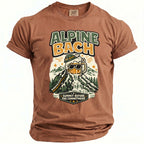 Brown t-shirt with "ALPINE BACH" graphic of a beer mug on a mountain.