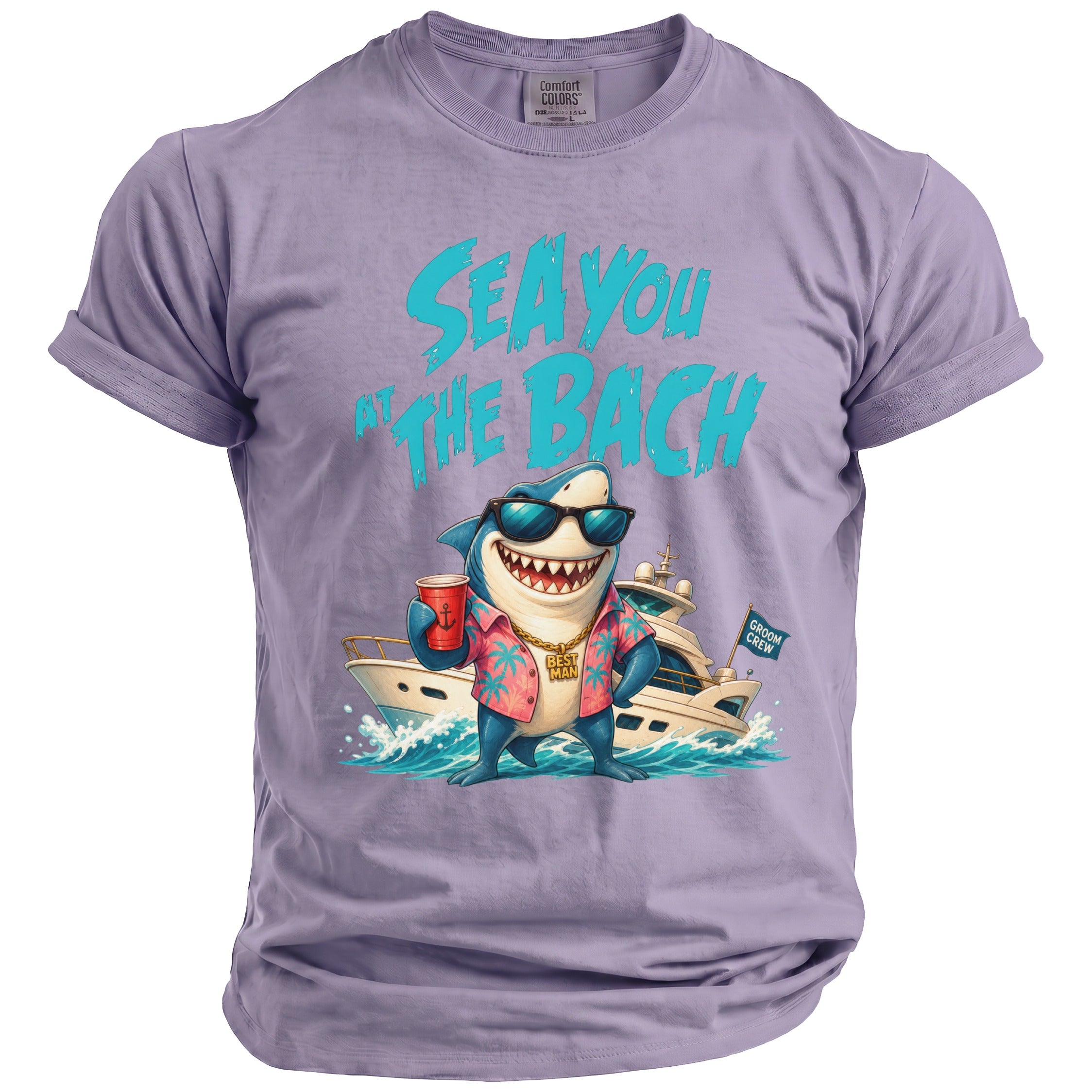 Light purple crewneck t-shirt featuring a cartoon shark wearing sunglasses in front of a yacht with text reading SEA YOU AT THE BACH.