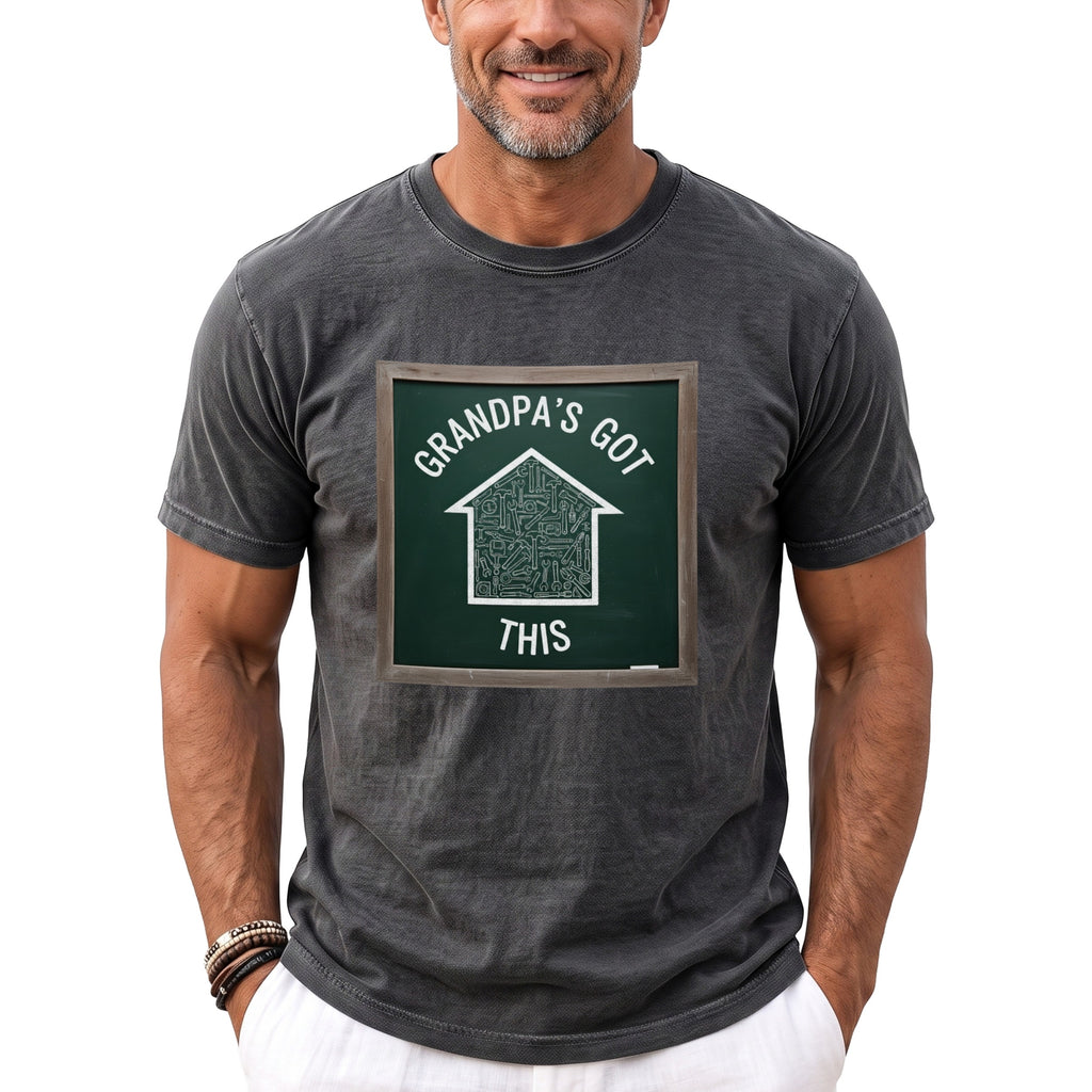 Dark grey t-shirt with a graphic of a house made of tools, reading "Grandpa's Got This".