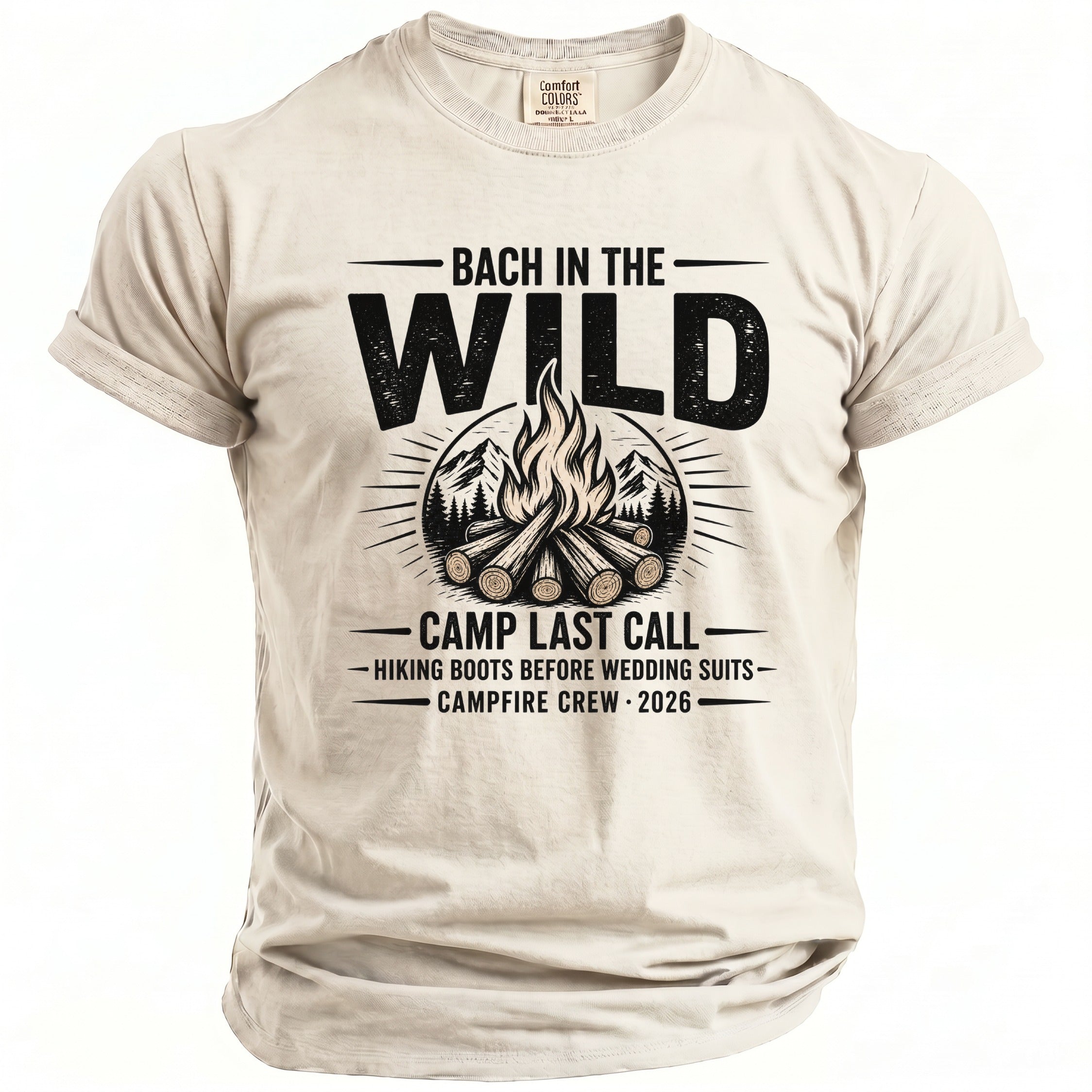Beige t-shirt with "Bach in the Wild" text, campfire graphic, and 2026 date.