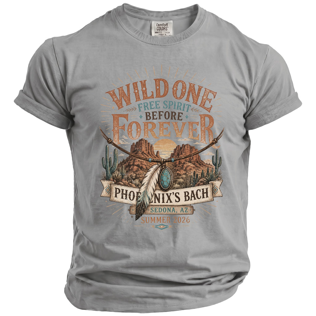 Gray t-shirt featuring a desert landscape, cacti, and text "Wild One Free Spirit Before Forever Phoenix's Bach Sedona, AZ Summer 2026."