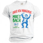 White t-shirt with "Under New Management Mike's Bach" and cartoon character.