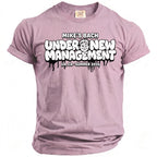 Lilac t-shirt with "Mike's Bach Under New Management" graphic and cartoon face.