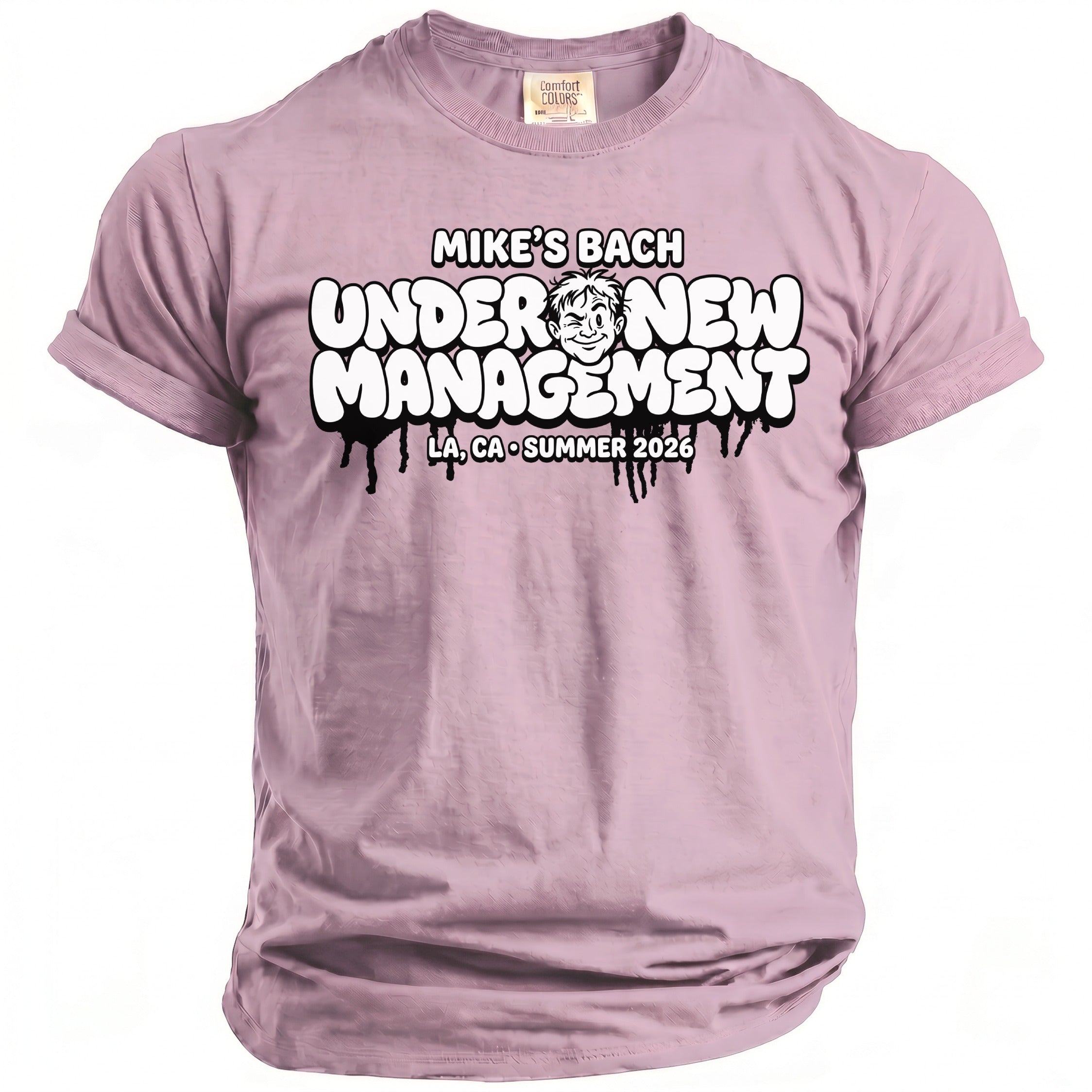 Lilac t-shirt with "Mike's Bach Under New Management" graphic and cartoon face.