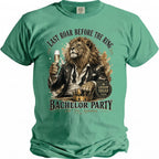 Green t-shirt with lion raising champagne glass and "Last Roar Before the Ring" text.