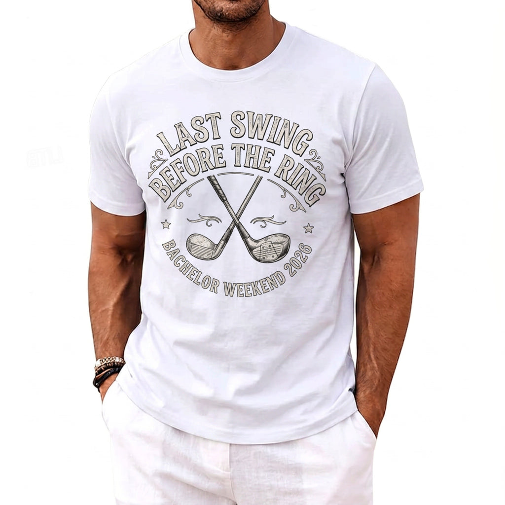 White t-shirt with text "Last Swing Before The Ring Bachelor Weekend 2026" and crossed golf clubs.