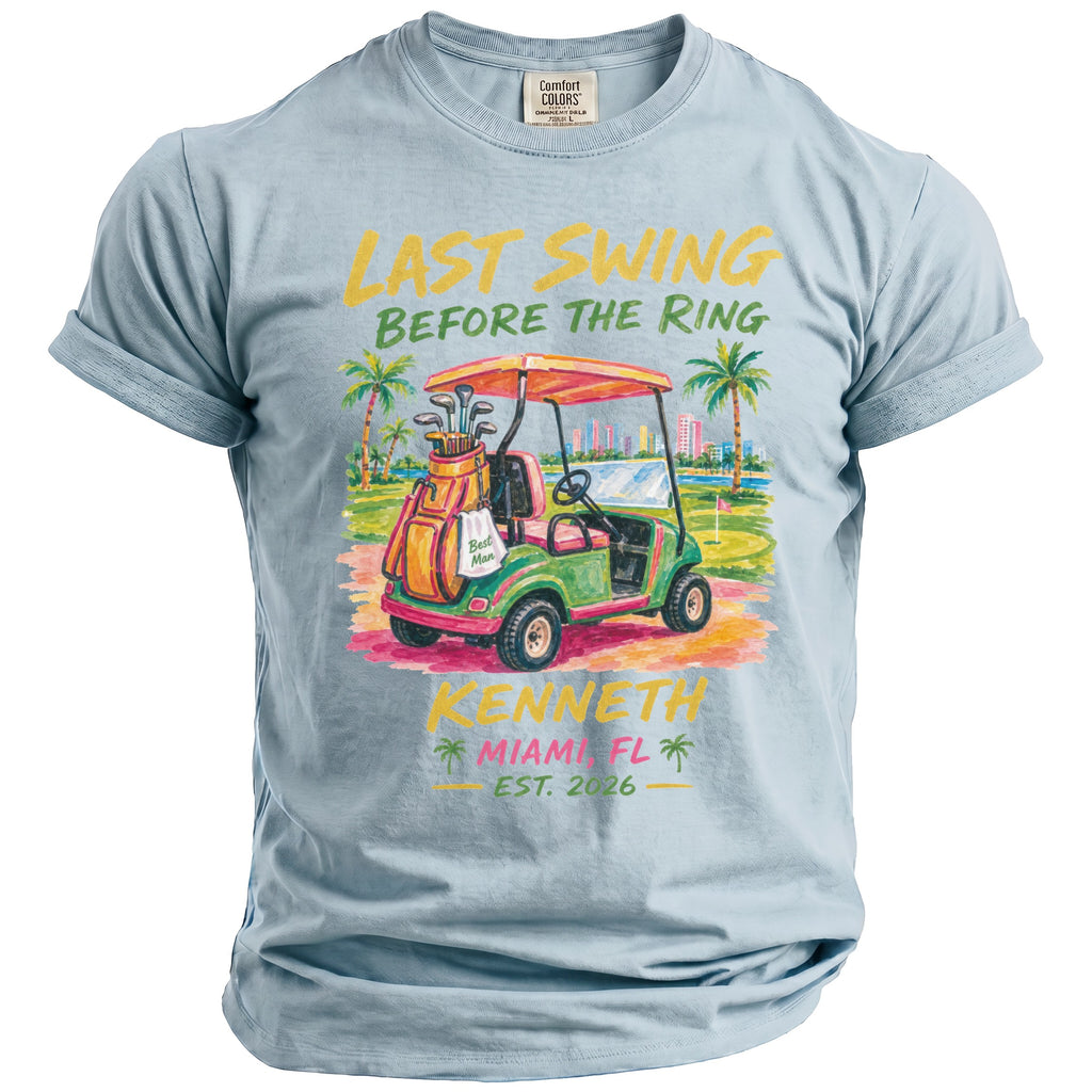 Light blue t-shirt with text "Last Swing Before The Ring" and a golf cart.