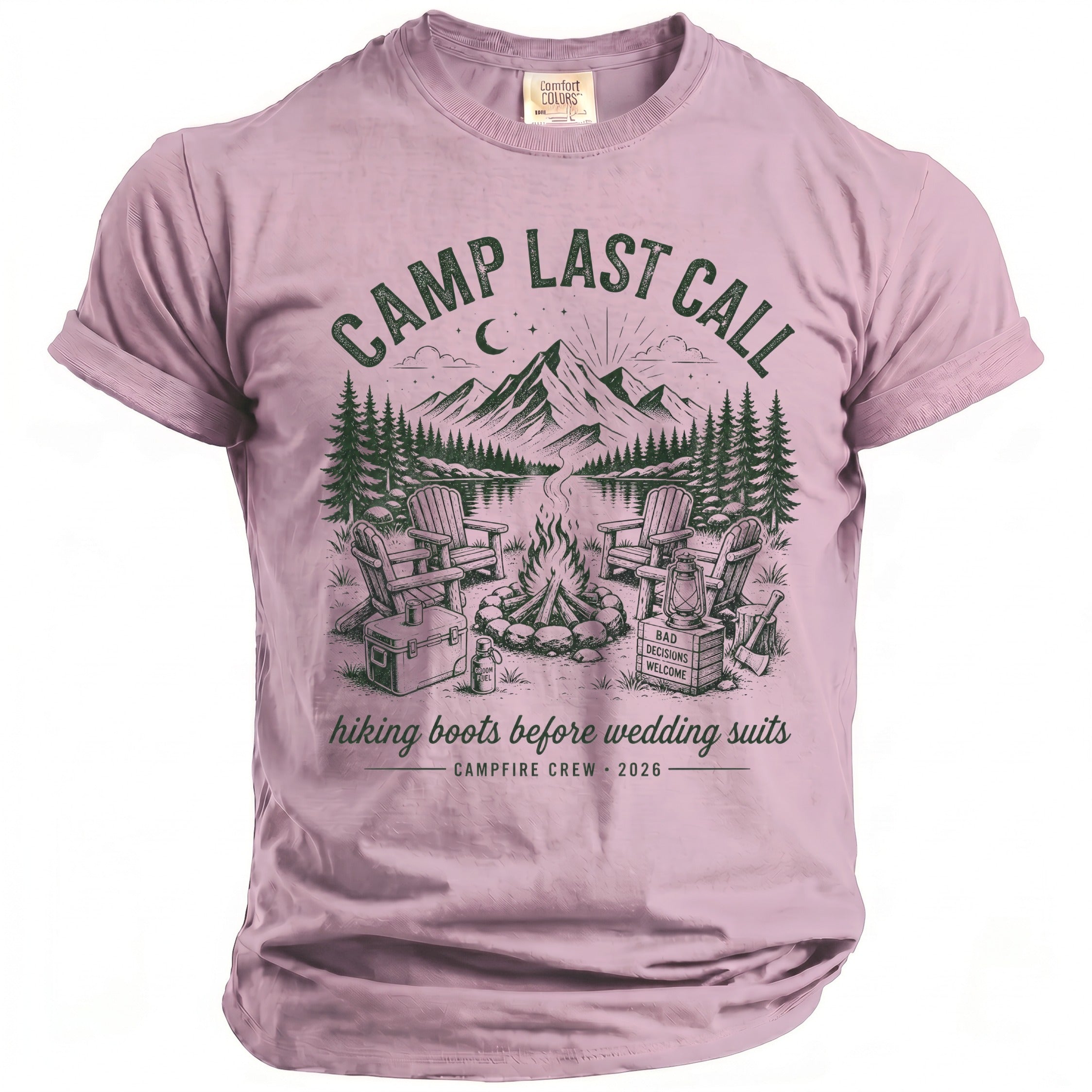 Pink t-shirt with graphic of campfire, chairs, mountains, and text.
