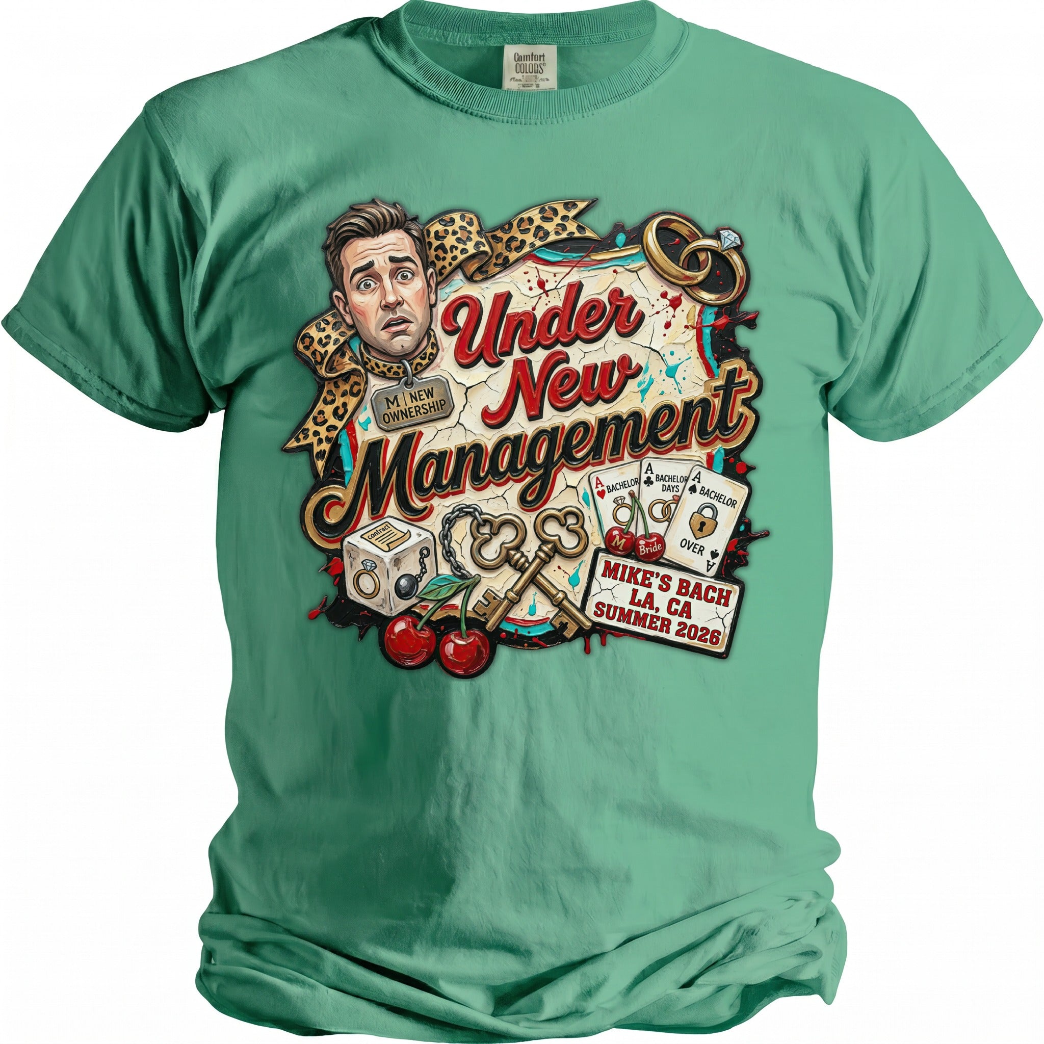 Green t-shirt with "Under New Management" graphic, featuring a man's surprised face, wedding rings, and dice.