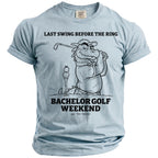 Light blue t-shirt with graphic text "LAST SWING BEFORE THE RING BACHELOR GOLF WEEKEND".