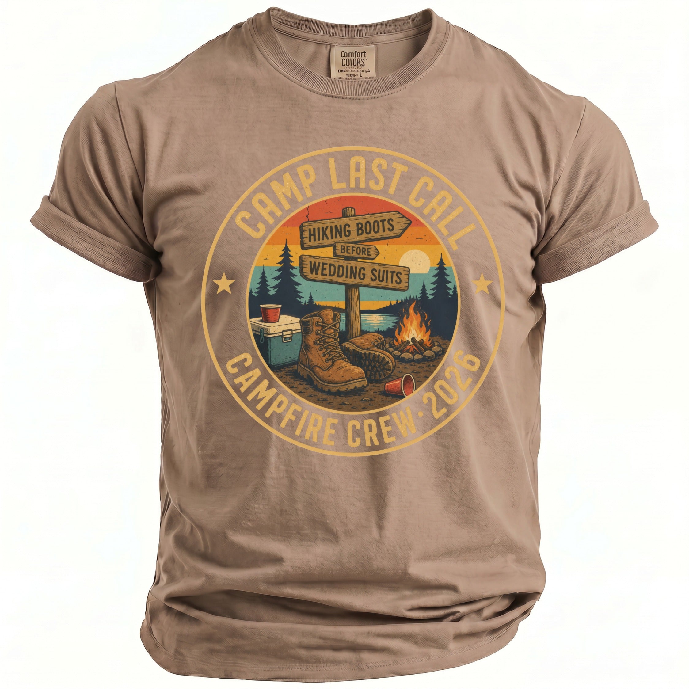 Brown t-shirt with "Camp Last Call" graphic featuring hiking boots, campfire, and signs.