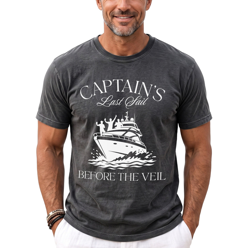 Dark grey t-shirt with "Captain's Last Sail Before The Veil" text and boat graphic.