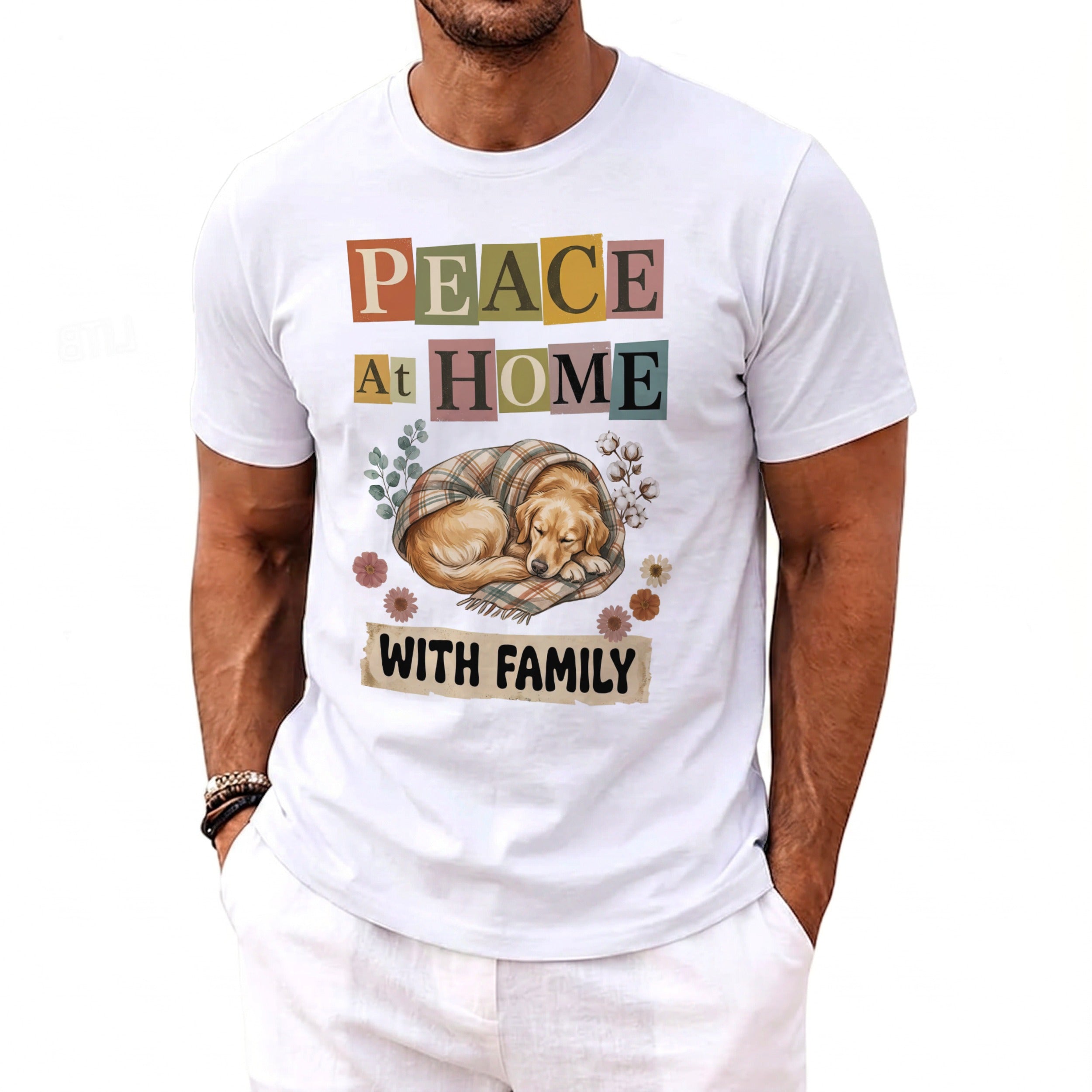 White t-shirt with text "PEACE AT HOME WITH FAMILY" and a sleeping dog graphic.