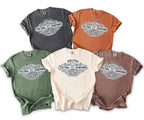 Five t-shirts in various colors with a "Mike's Bach" countdown graphic.