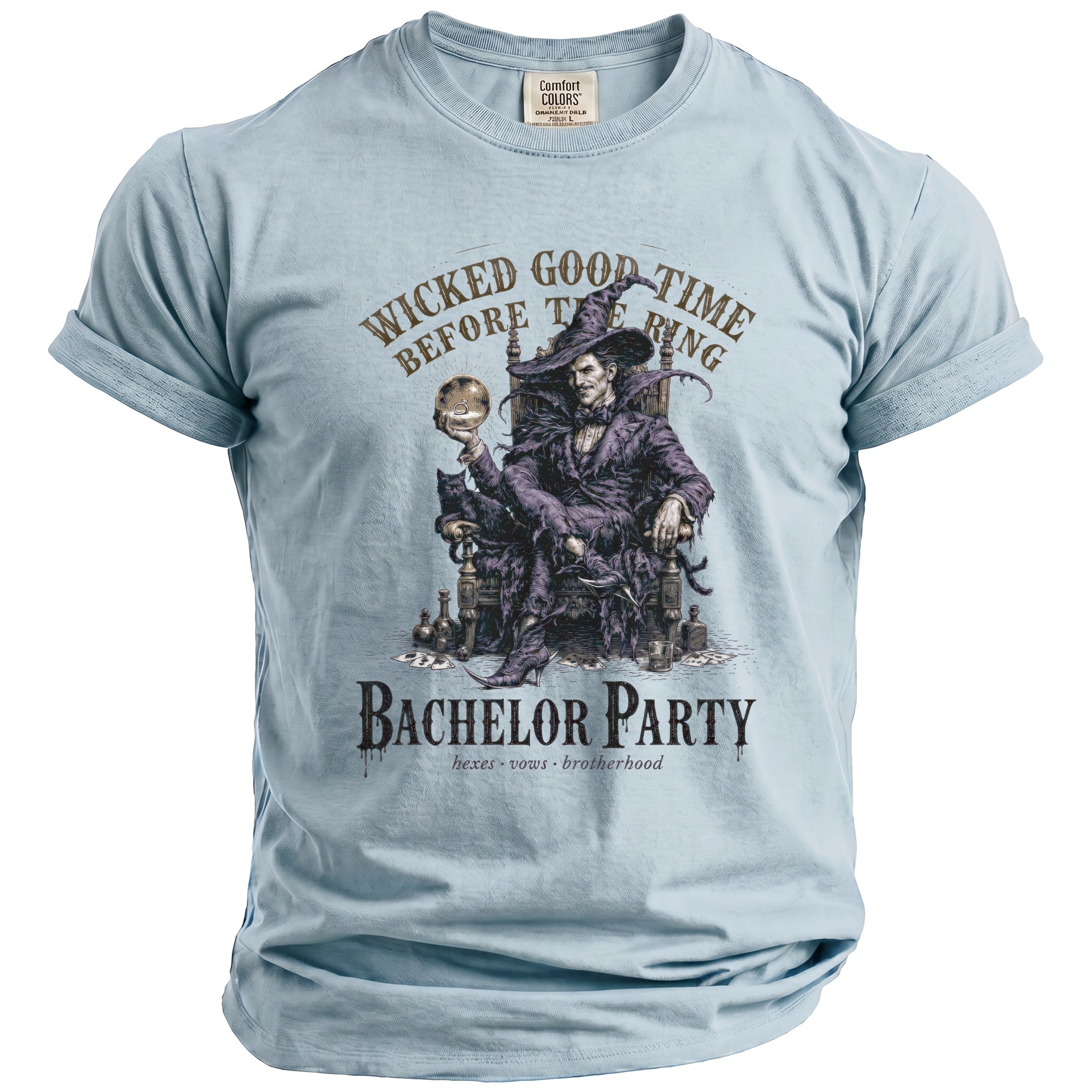 Light blue t-shirt with a graphic of a seated figure holding a ring and text "WICKED GOOD TIME BEFORE THE RING BACHELOR PARTY".
