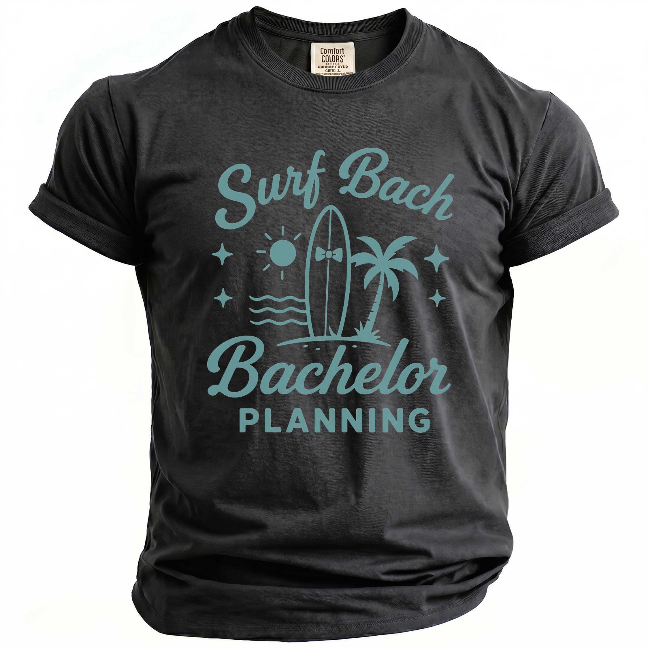 Dark grey t-shirt with "Surf Bach Bachelor Planning" text and beach graphic.