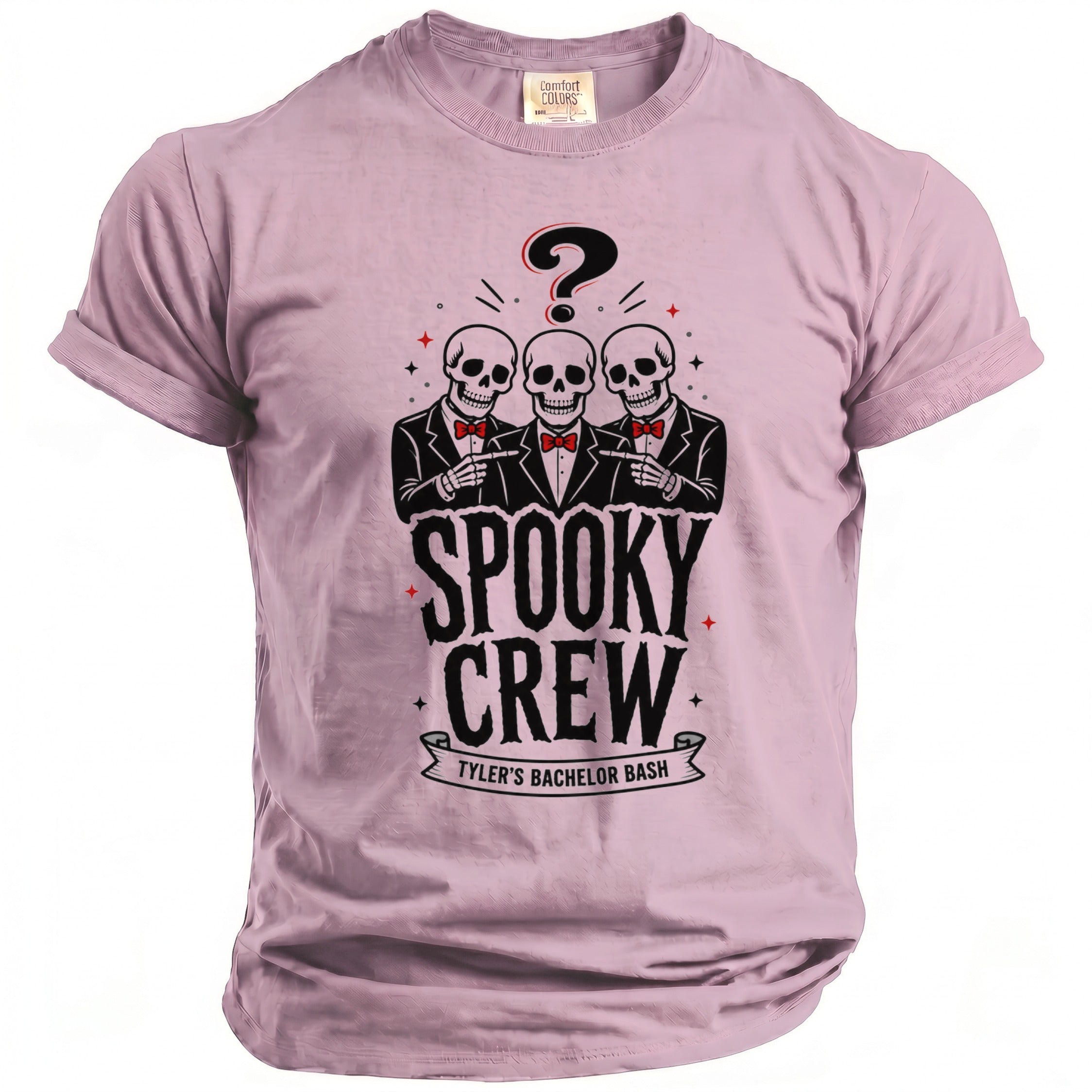 Pink t-shirt with a graphic of three skeletons in suits pointing, a question mark, and the text "SPOOKY CREW TYLER'S BACHELOR BASH".