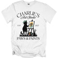 White t-shirt with "Charlie's Art Studio" and a cat painting a paw print.