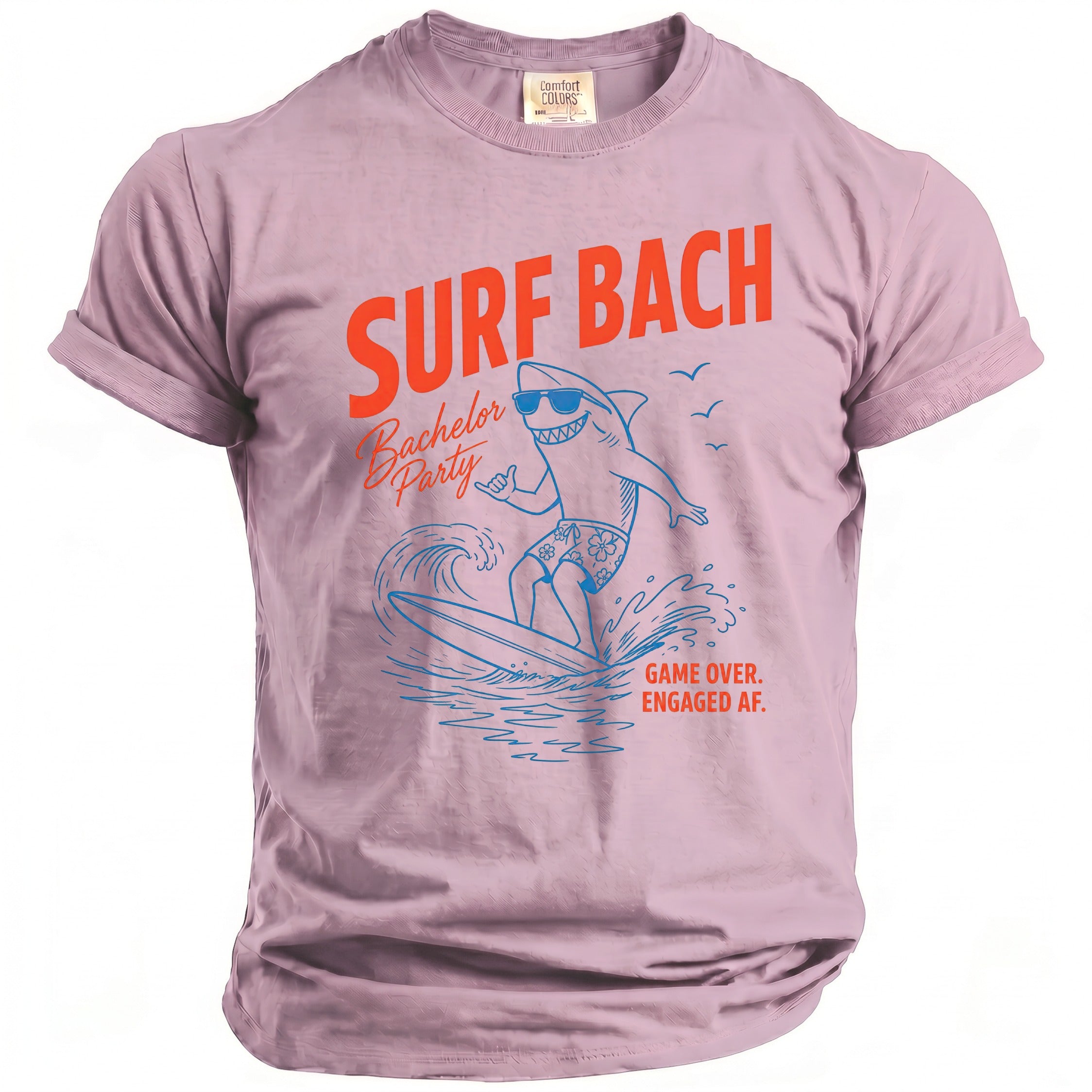Pink t-shirt with "Surf Bach Bachelor Party" and shark surfing graphic.