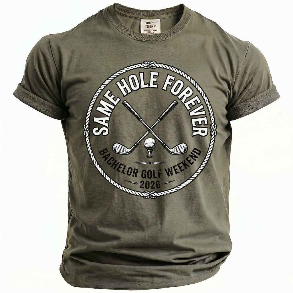 Olive green t-shirt with the text "Same Hole Forever, Bachelor Golf Weekend 2026".