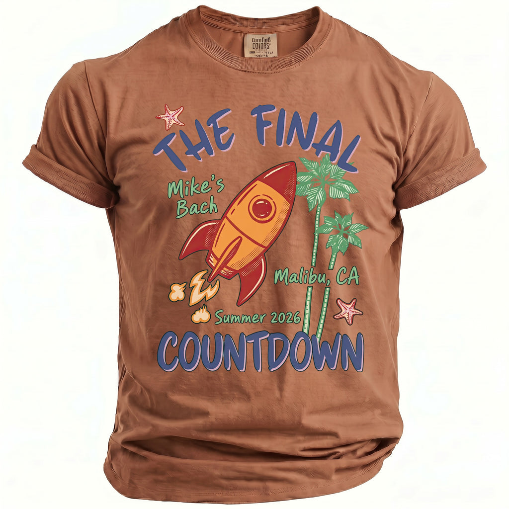 Brown t-shirt with graphic: The Final Countdown, rocket, palm trees, Malibu, CA.