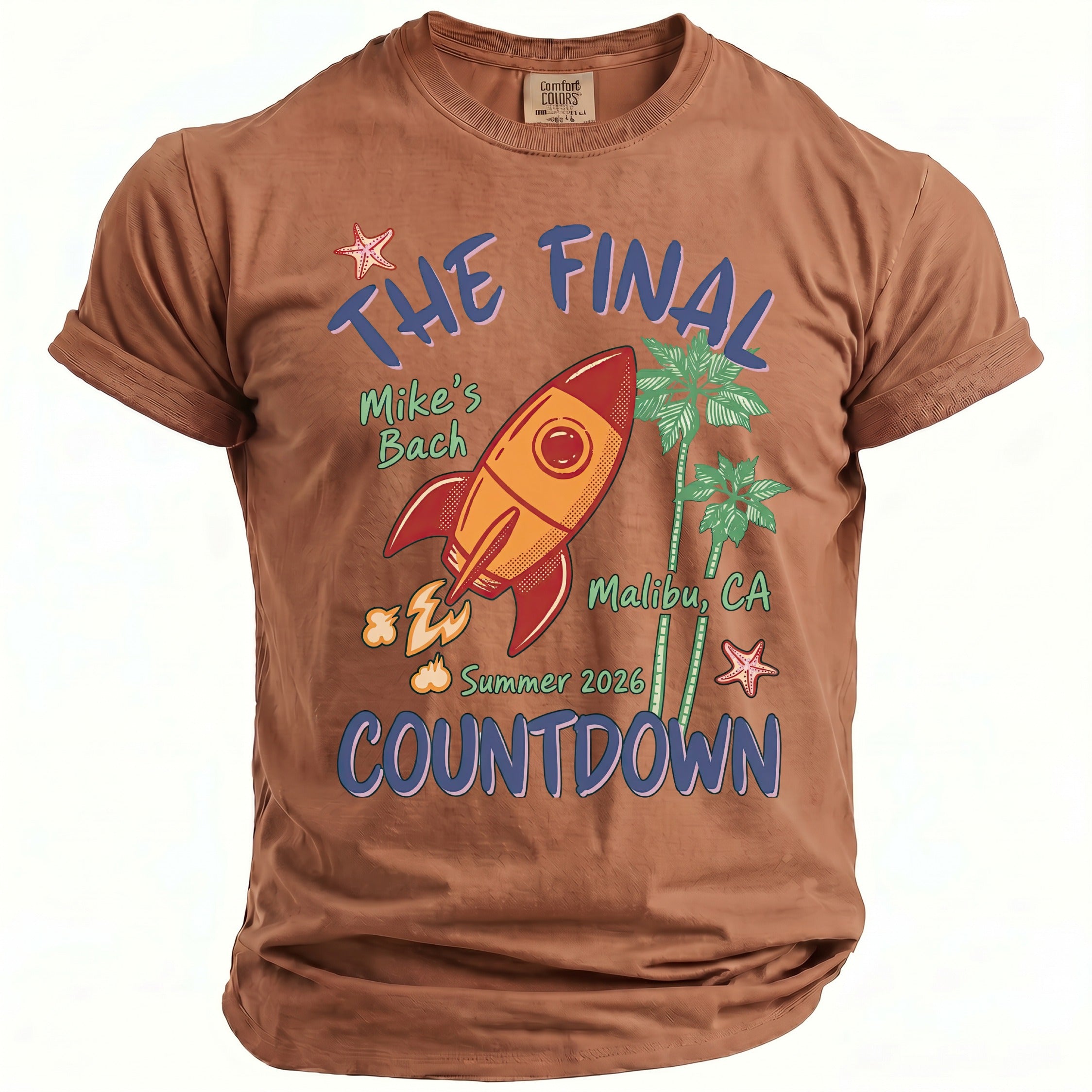 Brown t-shirt with graphic: The Final Countdown, rocket, palm trees, Malibu, CA.