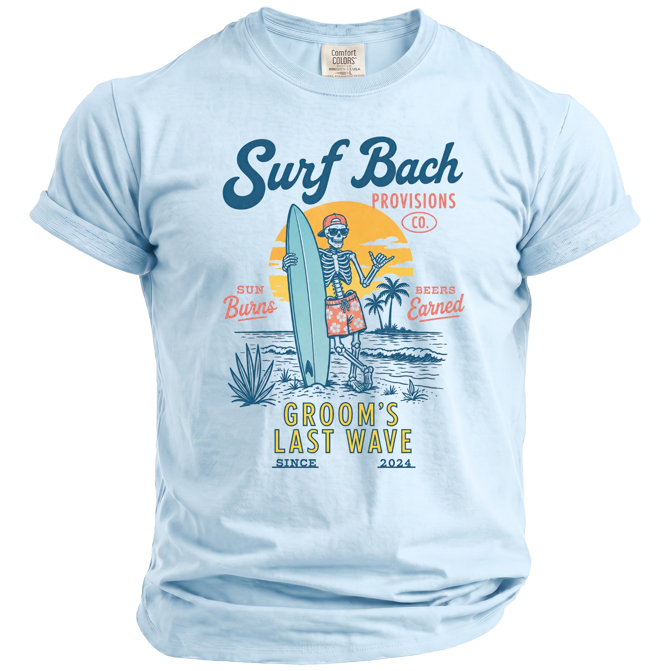 Light blue t-shirt with skeleton surfing text: Surf Bach Provisions Co., Sun Burns, Beers Earned, Groom's Last Wave.