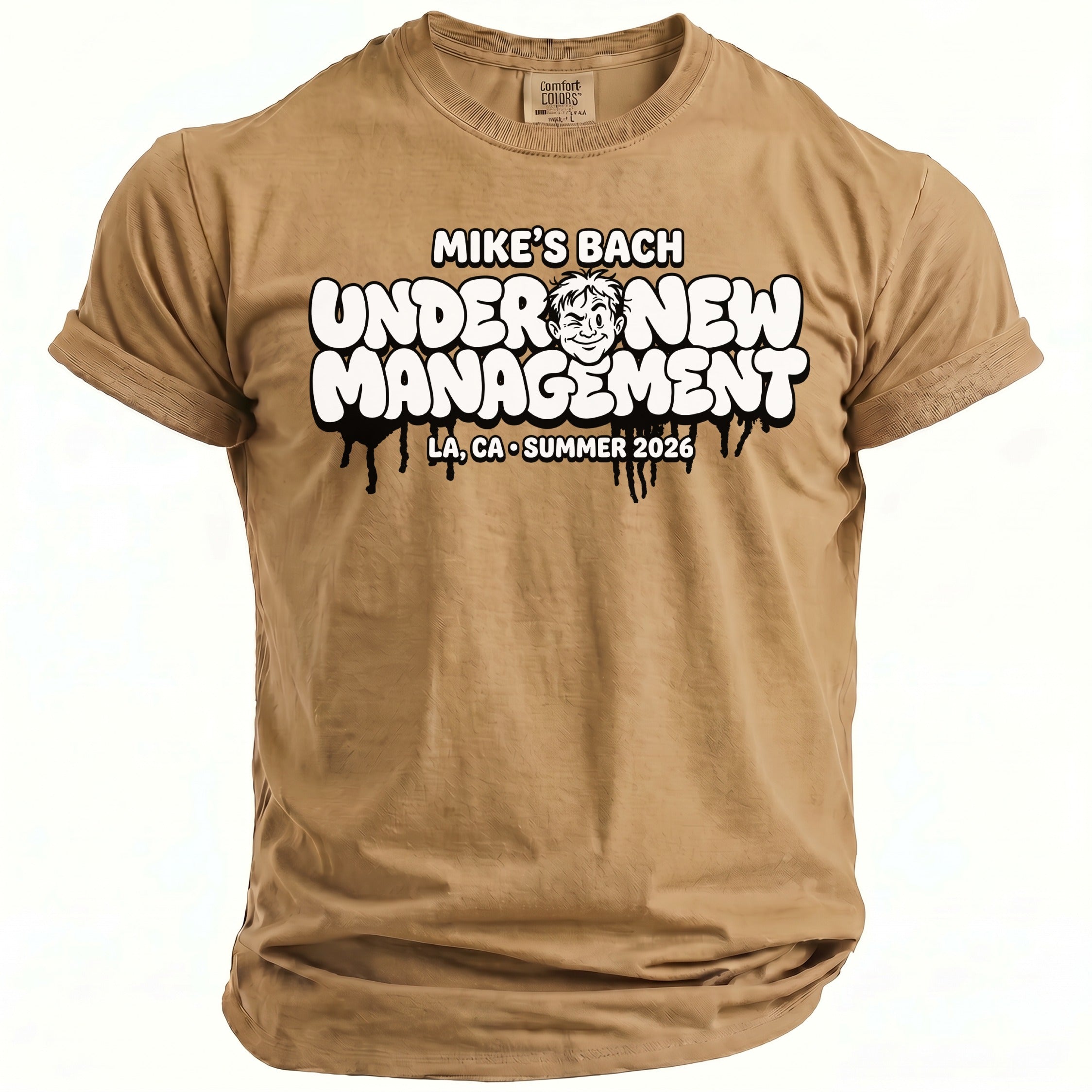 Tan t-shirt with text "MIKE'S BACH UNDER NEW MANAGEMENT LA, CA SUMMER 2026"