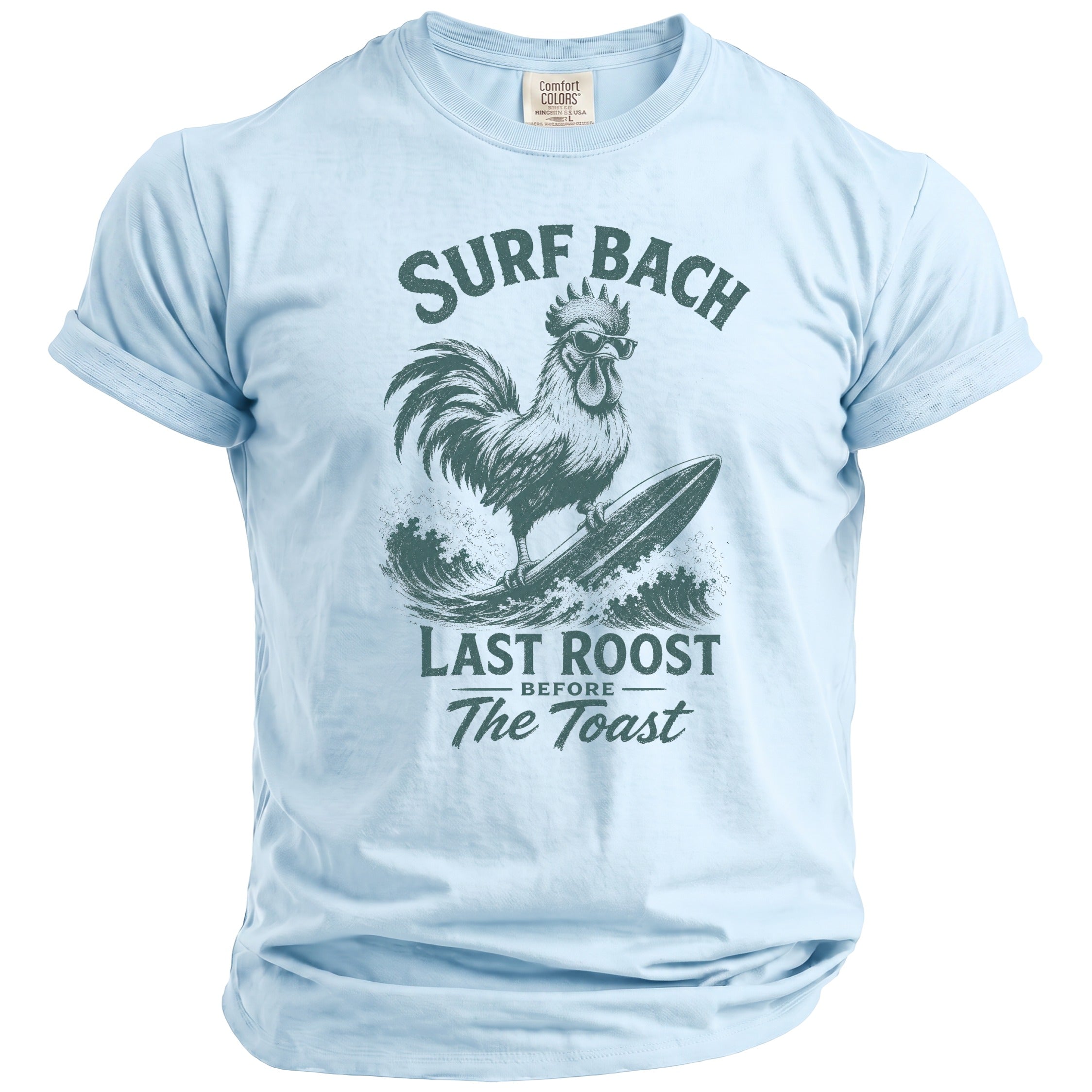 Light blue t-shirt with a distressed graphic of a rooster surfing and text "SURF BACH LAST ROOST BEFORE The Toast".