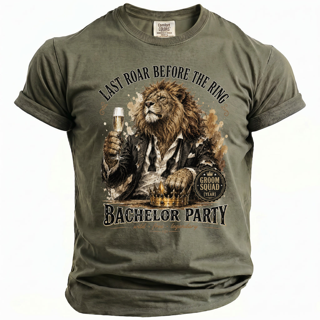 T-shirt with a lion in a suit holding champagne, "Last Roar Before the Ring" and "Bachelor Party" text.