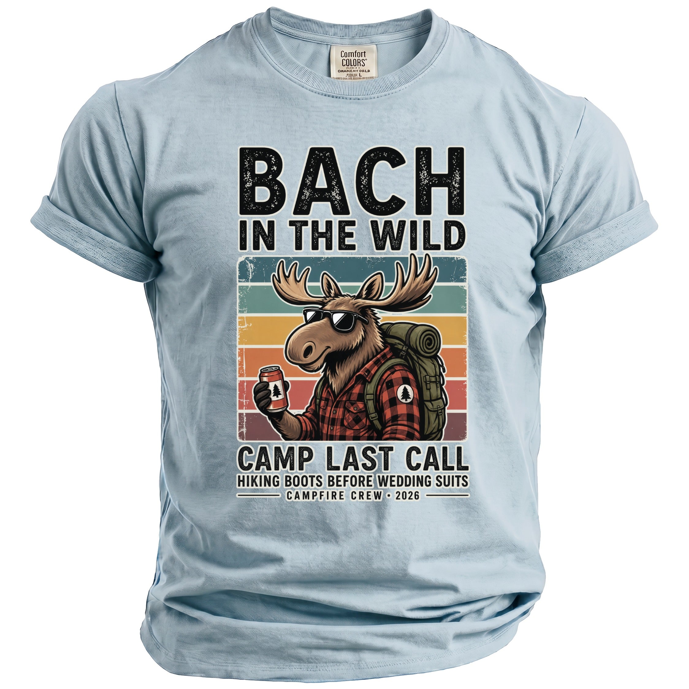 Light blue t-shirt with a moose in sunglasses, holding a can, with "BACH IN THE WILD" and "CAMP LAST CALL".