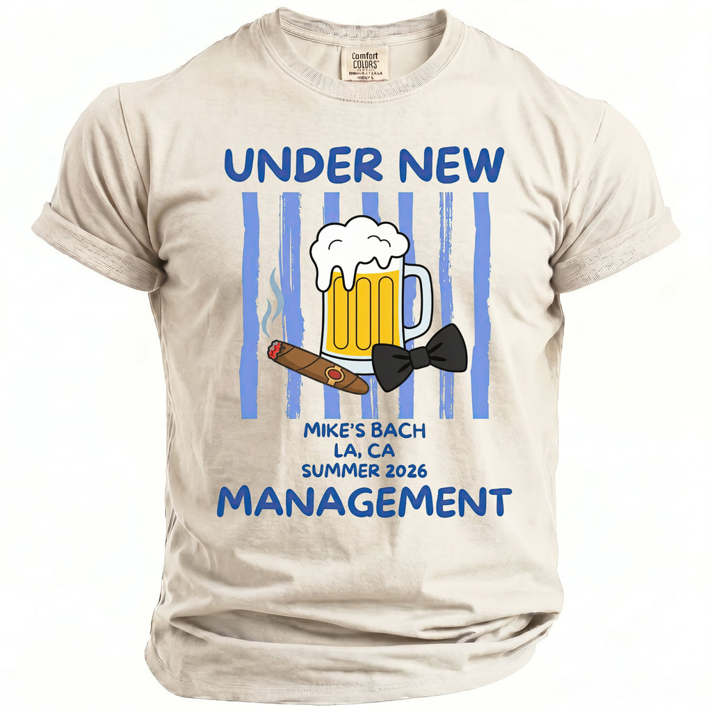 Light beige t-shirt with "UNDER NEW MANAGEMENT" and beer, cigar, and bow tie graphics.