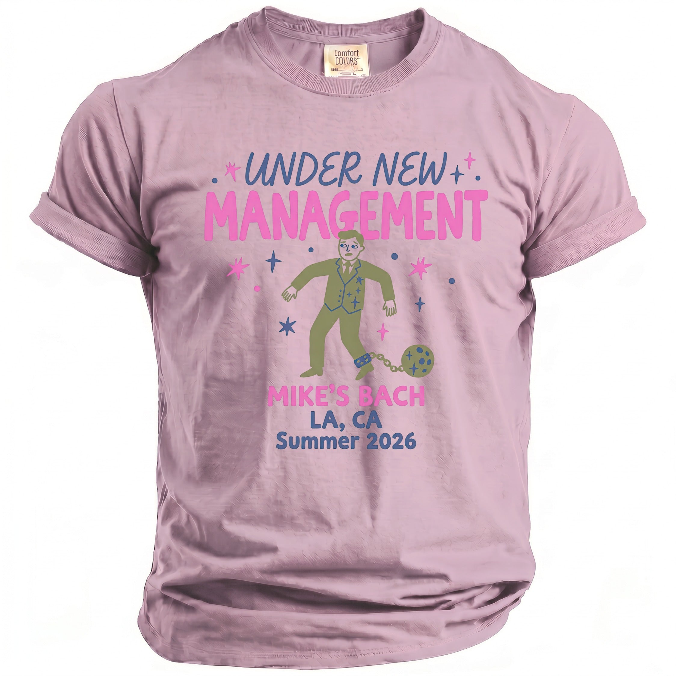 Pink t-shirt with "UNDER NEW MANAGEMENT" and illustration of man chained to ball.