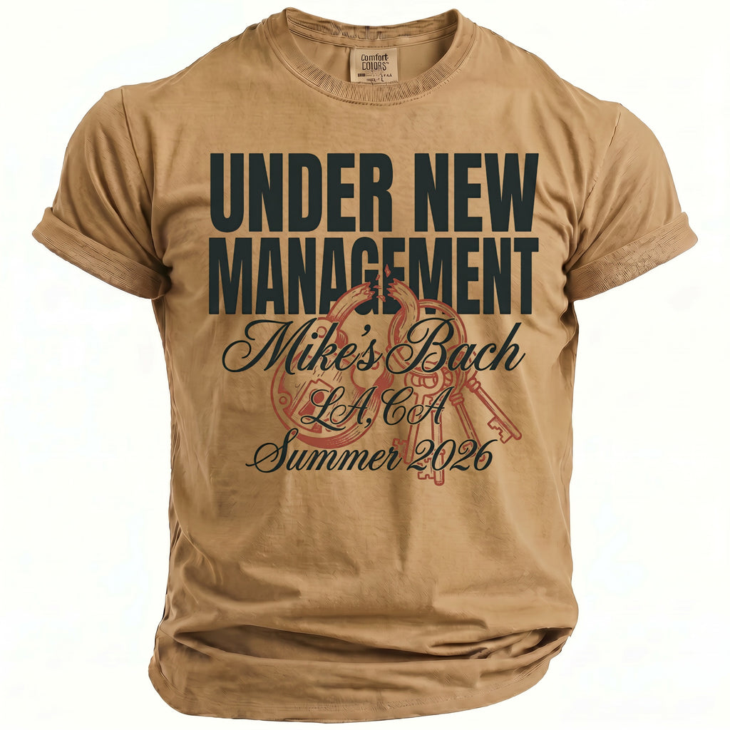 Tan t-shirt with "Under New Management" and "Mike's Bach LA, CA Summer 2026".