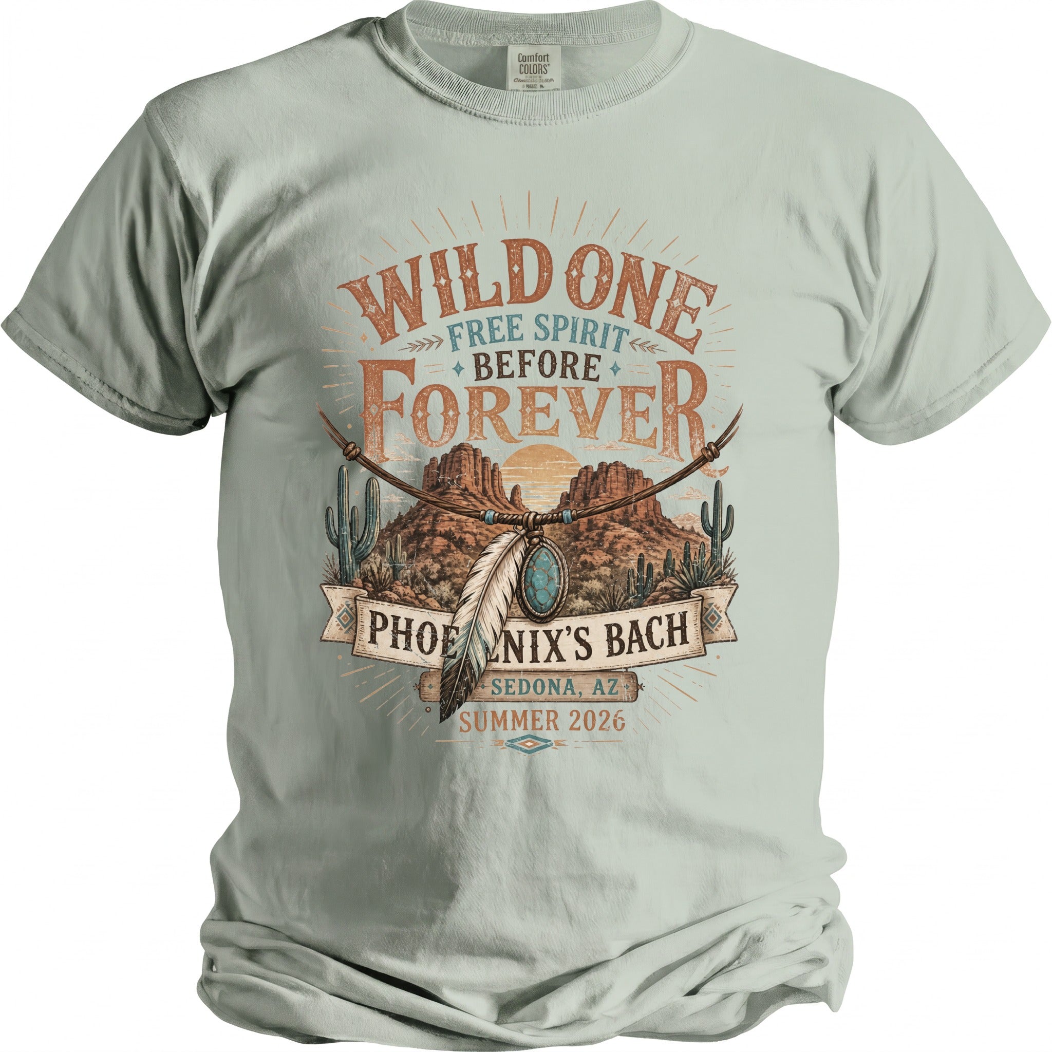 T-shirt with "Wild One Free Spirit Before Forever Phoenix's Bach Sedona AZ Summer 2026" graphic.