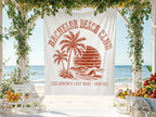 White tapestry with "Bachelor Beach Club Groom's Last Wave 2026" design on beach.